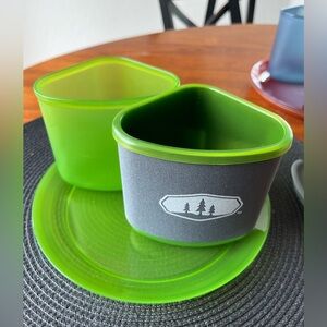 GSI Camp set, unused. 4 plates, bowls, insulated mugs. Great for backpacking!